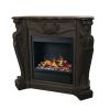 Black electric steam fireplace with stone surround.